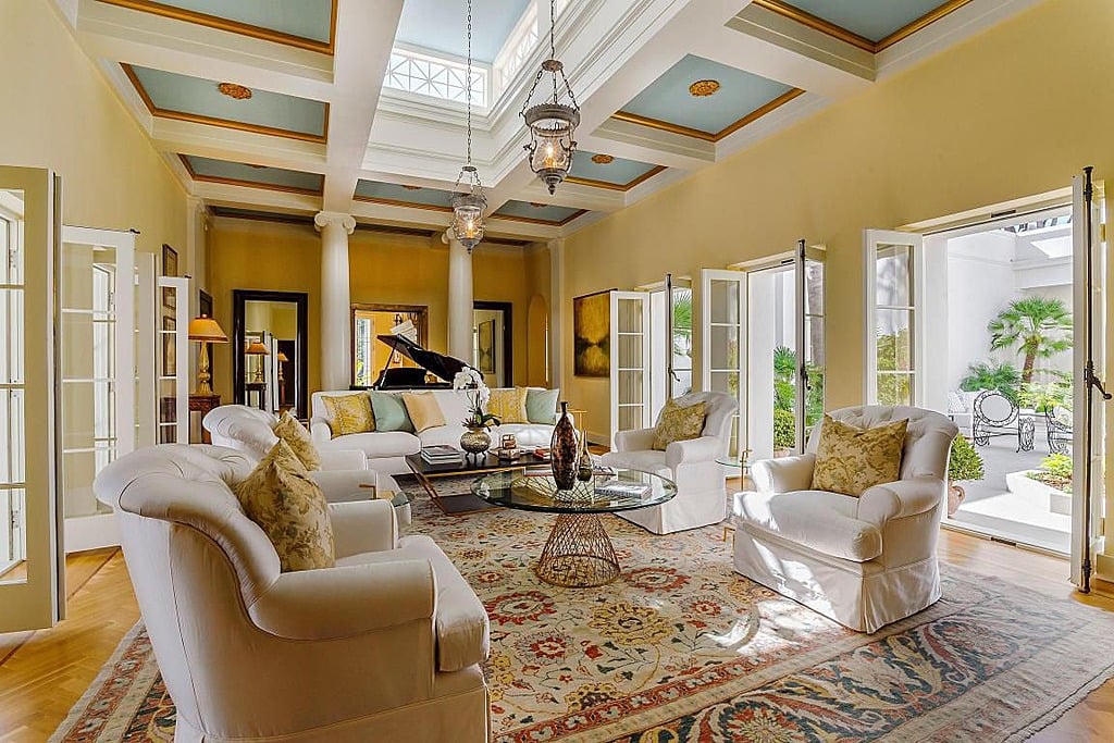 French doors on both sides create an open-air feel in this ...