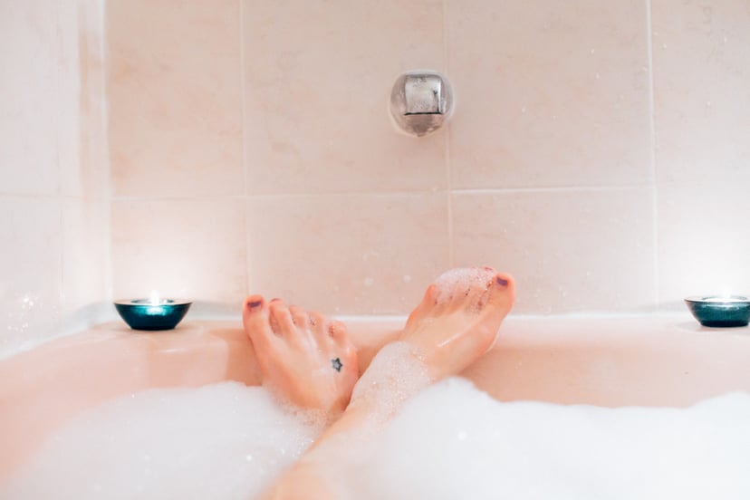 Woman's feet in bubble bath, bubble bath first person perspective, woman in bath tub, bubble bath, indulgence, bubbles, tub, bath first person perspective.