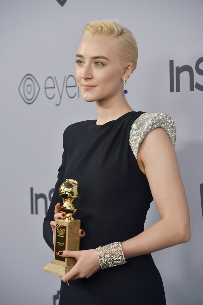 Saoirse Ronan added touches of silver to her Atelier Versace gown.