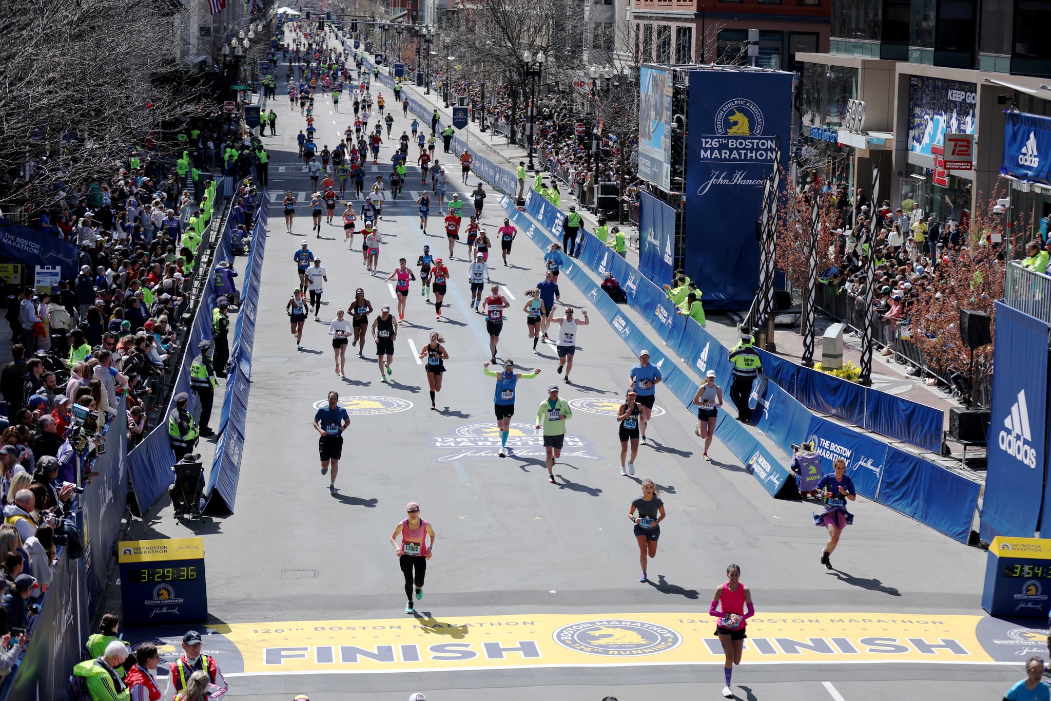 BOSTON, MASSACHUSETTS - APRIL 18: Runnings make their way down Boylston street to the finish line during the 126th Boston Marathon on April 18, 2022 in Boston, Massachusetts. (Photo by Omar Rawlings/Getty Images)