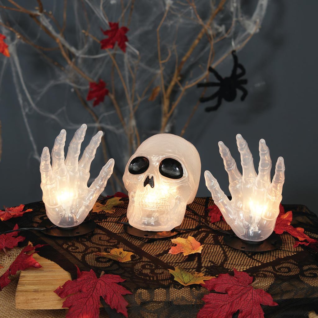 A Glowing Surprise: Way to Celebrate Halloween 3-Piece Skull With Hands Light Set