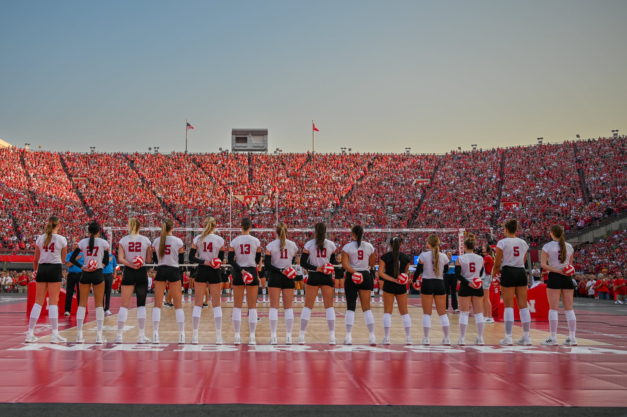 LINCOLN, NEBRASKA - AUGUST 30: The Nebraska Cornhuskers stand on the court during introductions before the game against the Omaha Mavericks at Memorial Stadium on August 30, 2023 in Lincoln, Nebraska. (Photo by Steven Branscombe/Getty Images)