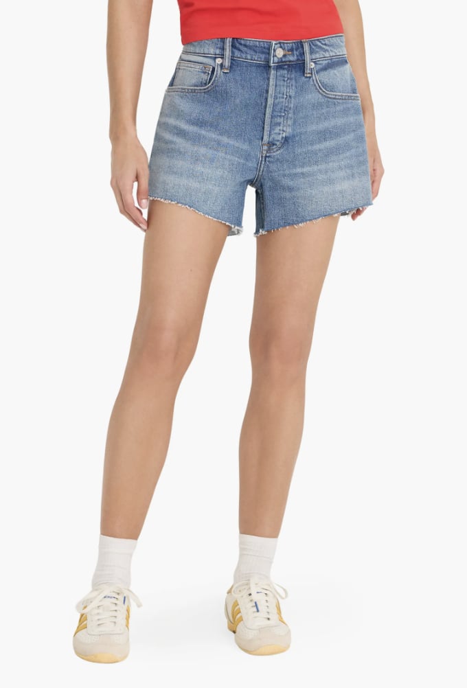 Good American Cutoff Denim Shorts ($128)
Denim shorts are a festival season staple because they're comfy and go with literally anything, from distressed tees to floral blouses. Get playful with different washes to find a look tailored to your style. The distressed details on these shorts make for a lived-in '90s feel.