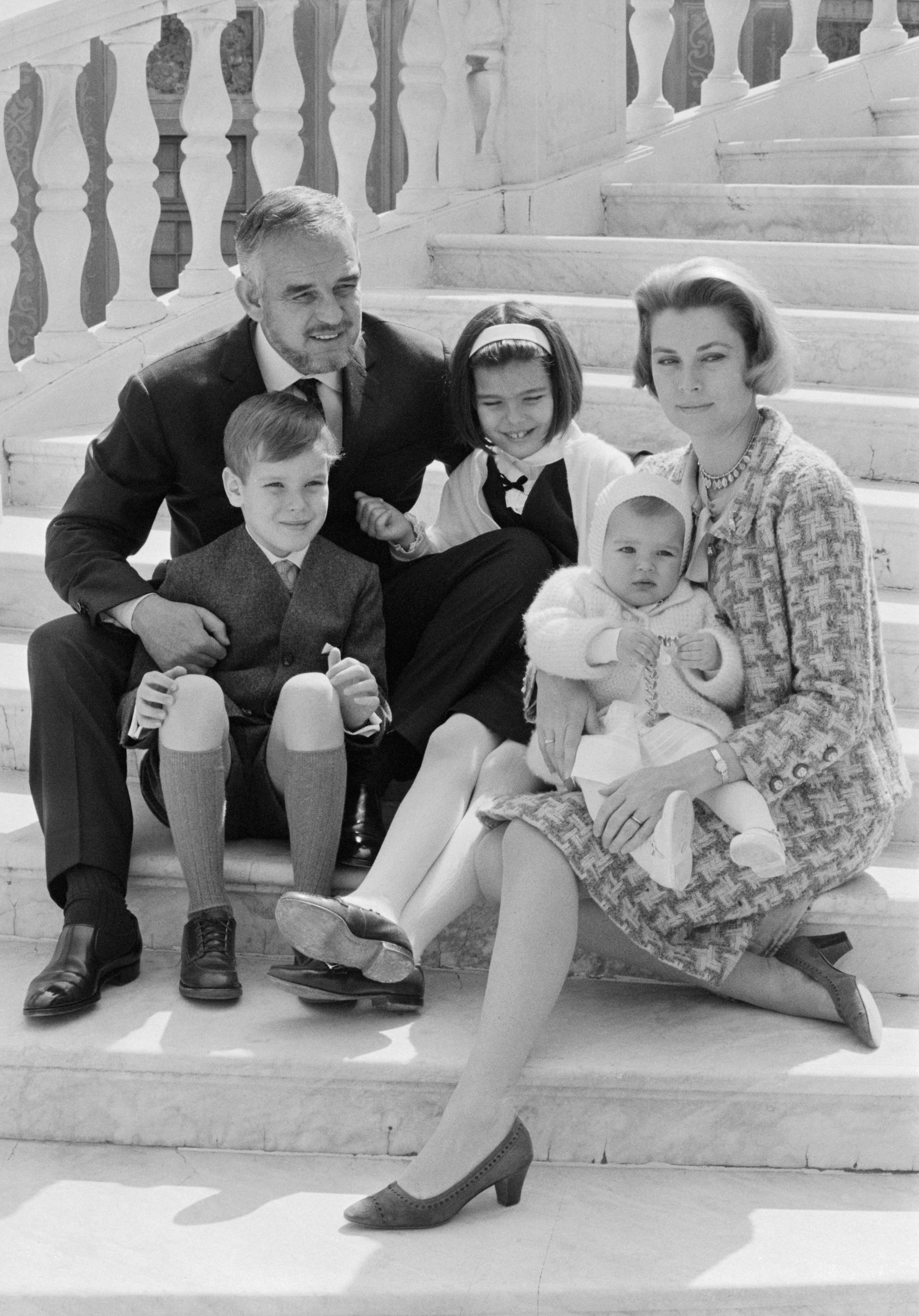 (Original Caption) Rainier and Grace Celebrate 10th Wedding Anniversary. Monte Carlo, Monaco: In connection with their tenth wedding anniversary celebration Prince Rainier and Princess of Monaco pose on the steps of the palace with their children: Princess Stephanie , 14 months; Princess Caroline, 9; and Prince Albert, 8. Asked to comment on 10 years of marriage, Princess Grace said: 