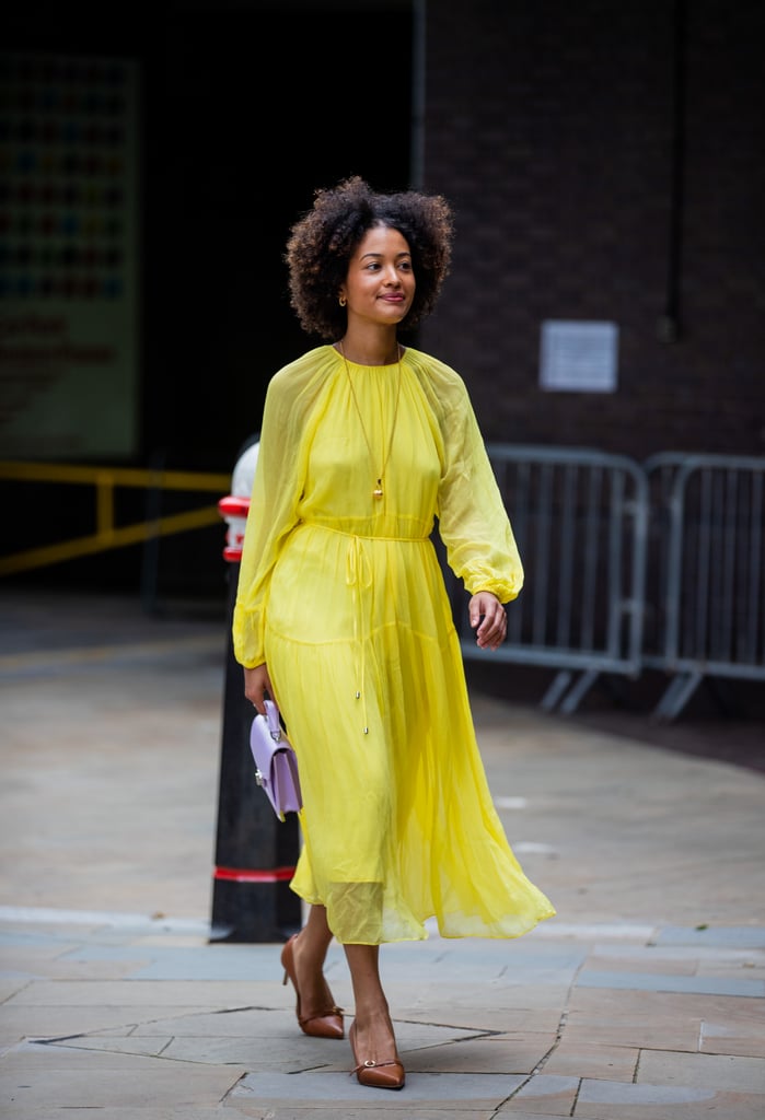 Caramel-coloured shoes and gold jewellery adds even more warmth to this canary yellow dress.