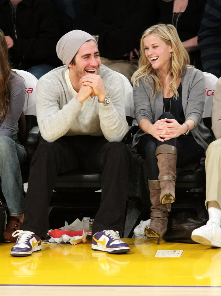 Jake Gyllenhaal and Reese Witherspoon laughed during a Lakers game in January 2009.