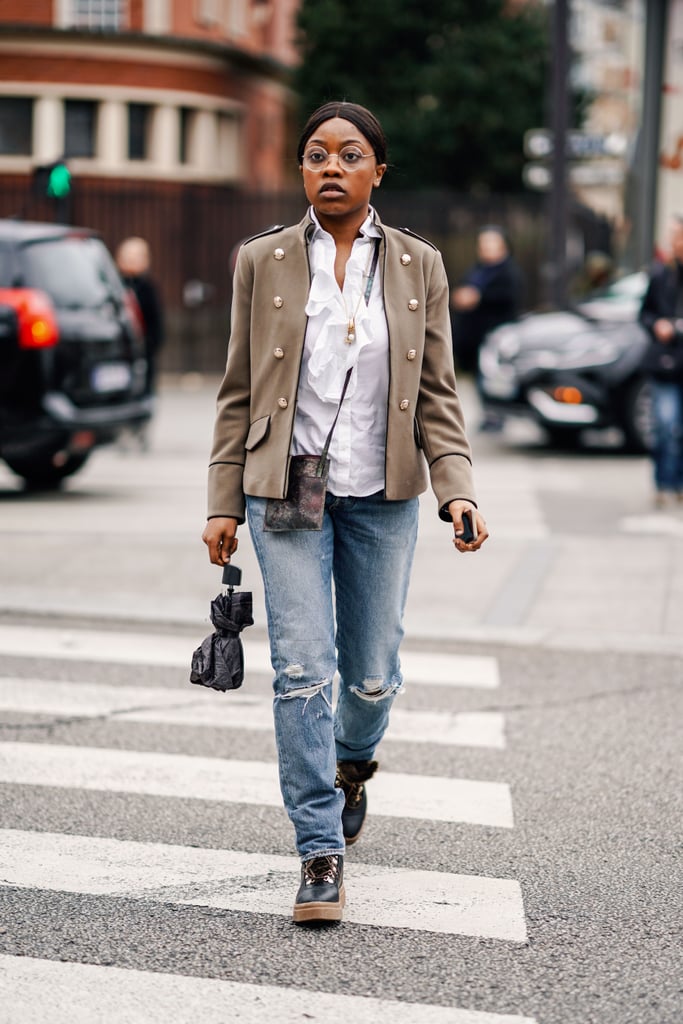 Elevate distressed jeans with a military jacket