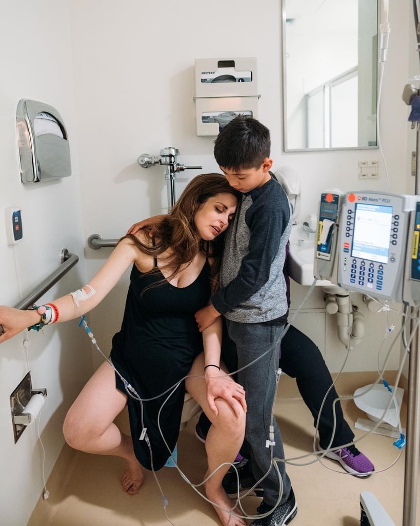 Hollie Lau, a mom of three and a doula, wanted her 9-year-old son Charlie to be in the delivery room when she welcomed her newborn daughter, Robin, in 2019. In an effort to normalize the birth experience and "give boys opportunities to be nurturing," Hollie appointed Charlie as a doula. She also recruited Ohio-based birth photographer Hannah Spencer to capture how she labored with Charlie by her side — and the results are absolutely incredible.
"Regardless of gender identity, it's important for children to witness childbirth to normalize the process of birth, which is still considered so taboo and a 'behind closed doors' activity to many," Hannah told POPSUGAR. "Too often, we place the sentimental, emotional, loving, caring characteristics of little humans inside a specific gender bucket. Witnessing birth can give a viewpoint into the power of laboring people and the beauty, strength, and courage those that give birth possess, and children are no exception to that."

    Related:

            
            
                                    
                            

            Emily Ratajkowski on Her Baby&apos;s Sex: "We Won&apos;t Know the Gender Until Our Child Is 18"
        
    
The option to be present at Robin's birth was always on the table for Hollie's two older kids, and Charlie jumped at the chance to participate. "The moment that we announced our pregnancy to our sons, Charlie asked if he could come," she explained. "As a family, we believe in creating opportunities for our sons to practice being nurturing, which our society doesn't easily or openly provide to boys. Family-centered birth is beautiful and can be an incredibly powerful moment together. We wanted to share that powerful bonding moment with them. It was also a great opportunity for my sons to witness how strong I am, as a person and as a woman."
"Having Charlie present through the hardest part of my labor gave me strength when I doubted myself."
Although there's understandably no way for a 9-year-old to have professional training or hands-on experience when it comes to assisting during a childbirth, the amount of mental support her oldest son offered got Hollie through the toughest moments of labor. 
"Having Charlie present through the hardest part of my labor gave me strength when I doubted myself," said Hollie. "His calming touch between contractions was so sweet and grounded me and allowed me to regain my focus. Both our sons spent a lot of time preparing to play a support role. Charlie took to the role very naturally. My sons asked to take a mini childbirth education class, which I taught, to prepare them mentally for witnessing birth. Having the people I care about the most cheering me on during the hardest thing I've ever done was exactly what I needed to get through it. His presence helped remind me that I had done this before and that I could do it again."
For Hannah, Hollie's birth was one of her favorites to shoot. Inspired by Hollie's dedication to inclusion and flipping the script when it comes to gender roles, it's an experience she'll never forget. "As a birth worker, I often get to witness other birth workers give birth, doulas included," said Hannah. "Her story was so incredible, and the support of her family, especially her children, was such a gift to be able to photograph, but above that, to witness as a woman, mother, and friend."
Read ahead to get a look at the incredible pictures Hannah captured of Hollie giving birth to her daughter with Charlie right by her side.

    Related:

            
            
                                    
                            

            A Mom With a Transgender Daughter on What&apos;s at Stake This Election: "These Are Human Rights"