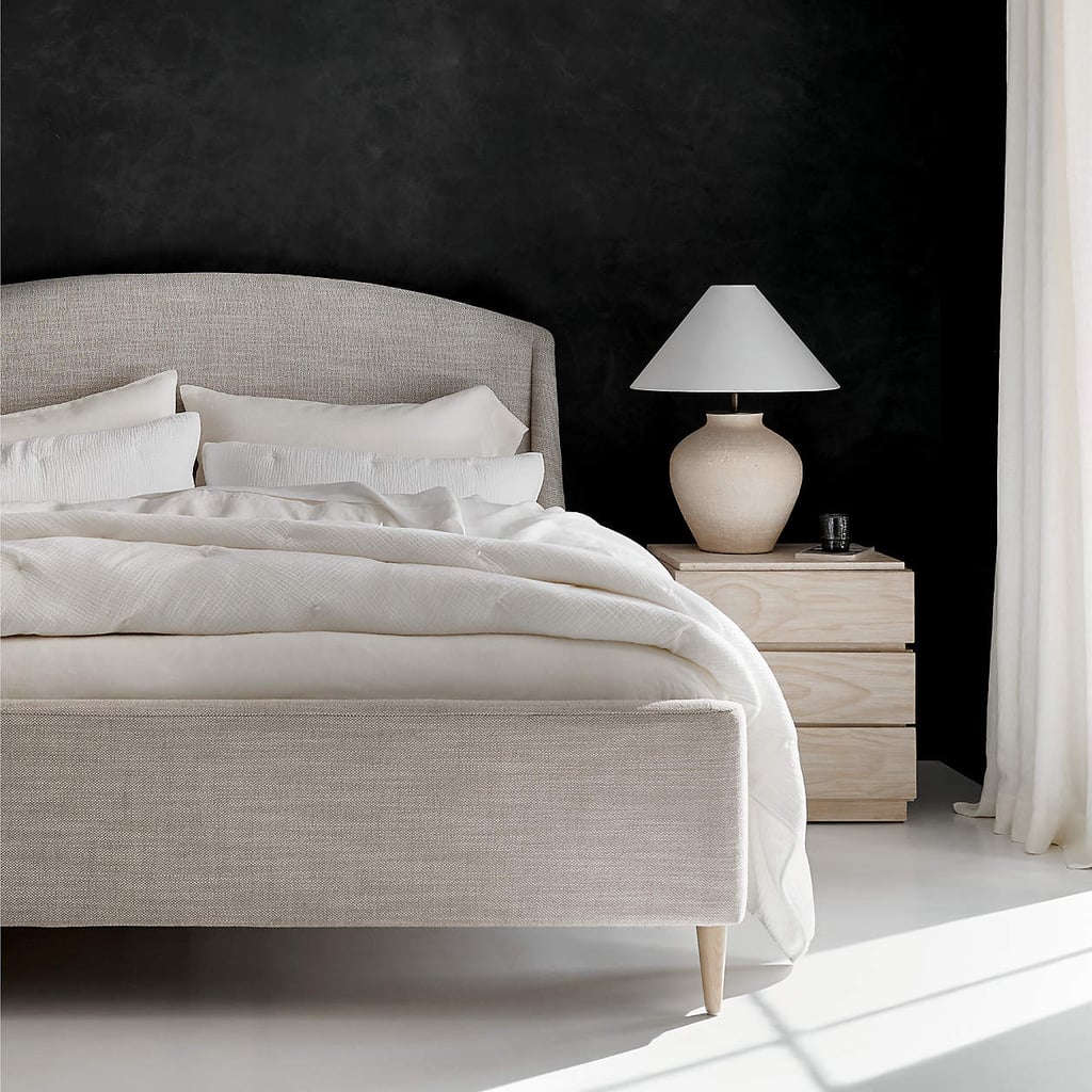 An Upholstered Bed Frame From Crate & Barrel