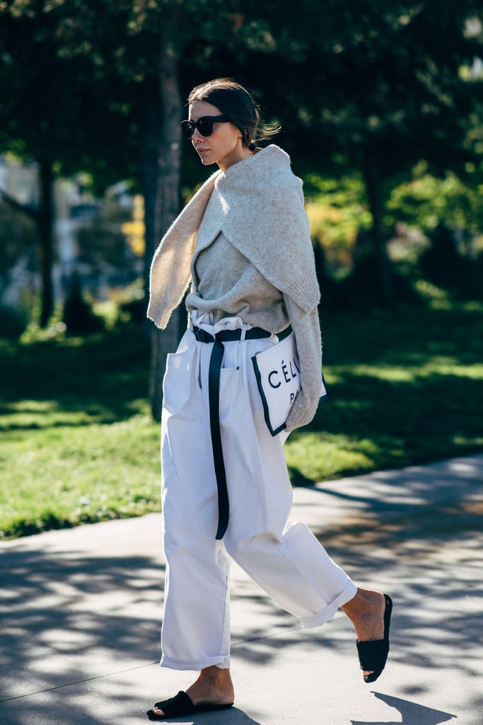 Wear Comfortable Black Slides With Paper-Bag Denim and a Contrasting Belt