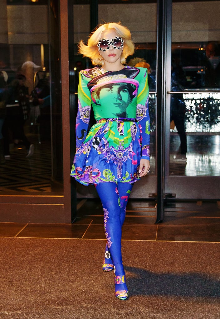 Wearing a vibrant Versace look.