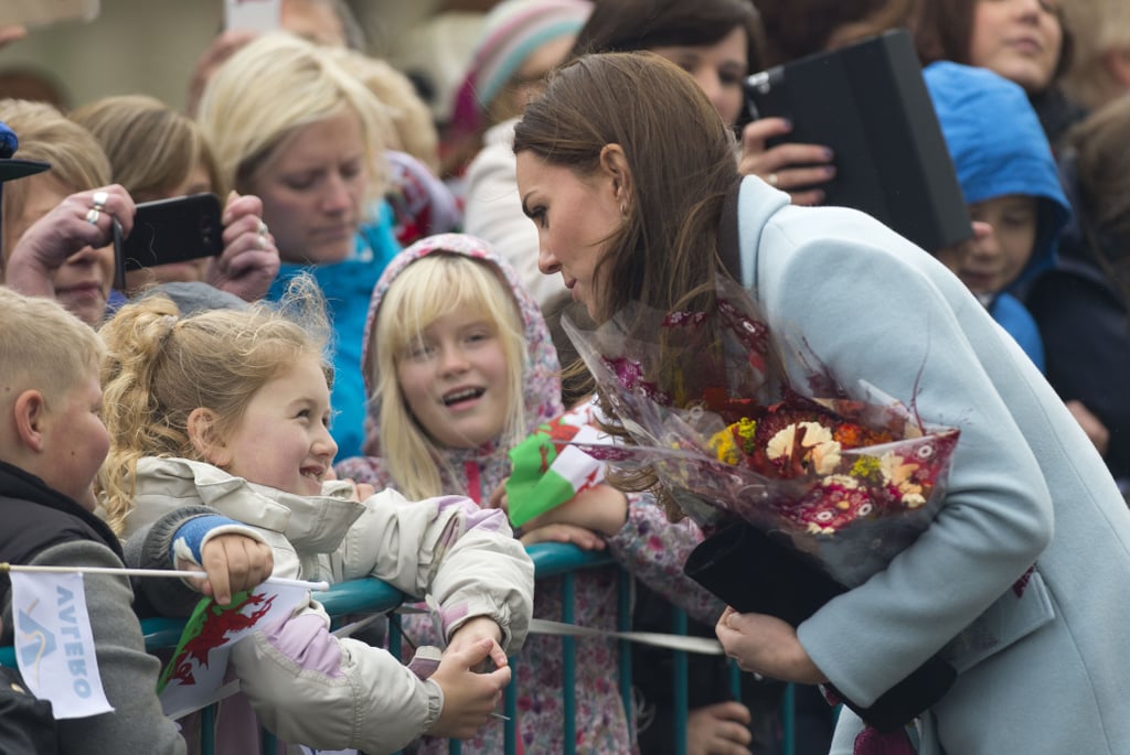 Kate greeted a group of kids outside the Pembroke Refinery in Wales in November 2014.