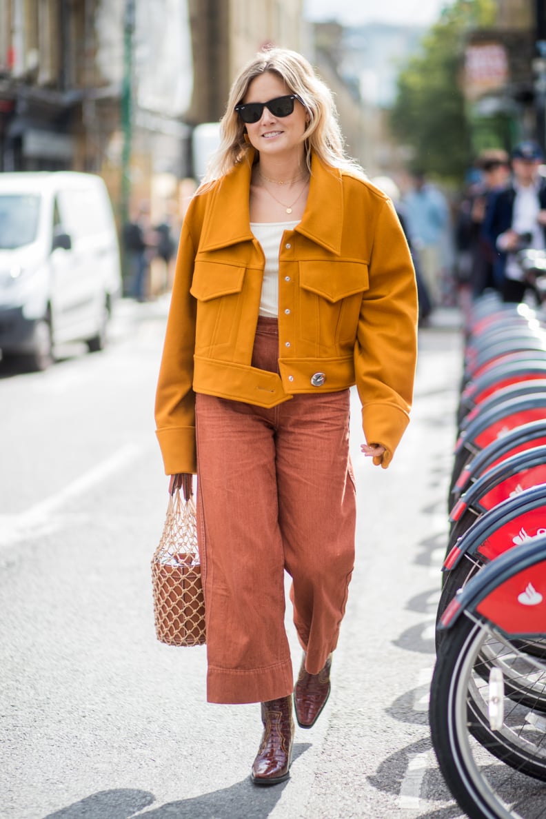 Wear Plenty of Different Orange Shades and Simply Throw on a Pair of Black Sunglasses