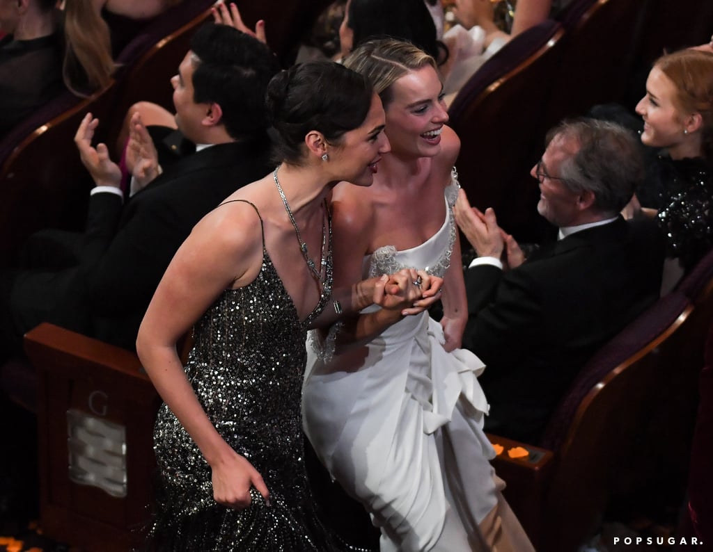 Gal Gadot and Margot Robbie held hands as they made their way through the aisle.