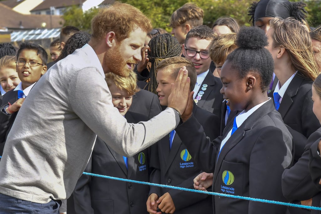 Prince Harry Hugs Kids at Lealands High School