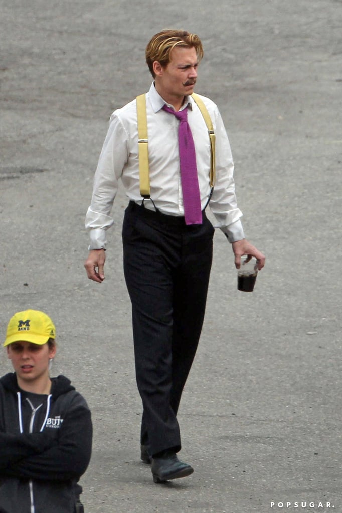 Johnny walked around the set in suspenders.