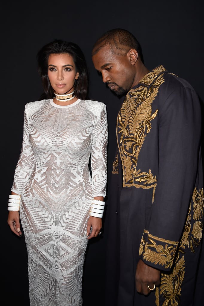 Kim wore a white gown with a choker while attending the Balmain show with Kanye during Paris Fashion Week in 2015.