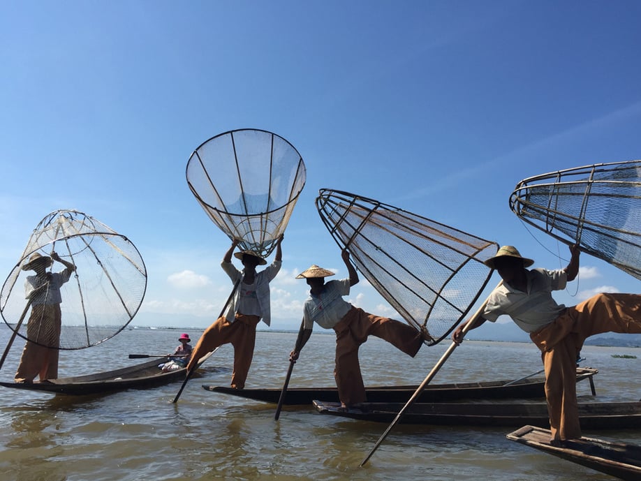 "Finding unexpected whimsy in a scene can make a photo more appealing — like this combination of nets, boats, and fishermen."