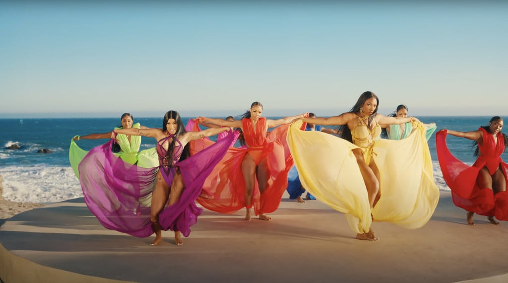 The whole group changes into a rainbow of elegant one-pieces with long tulle trains, making for a visually stunning shot.