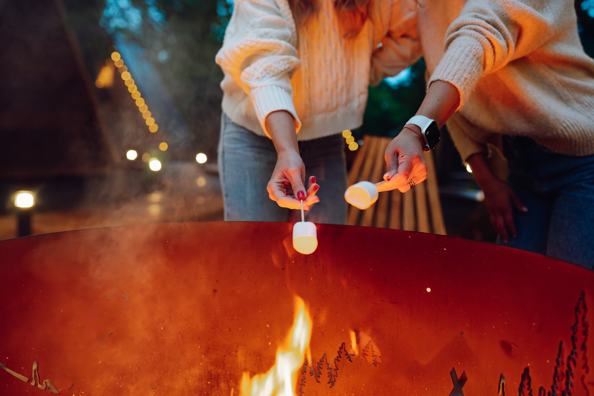 Woman roasting marshmallows