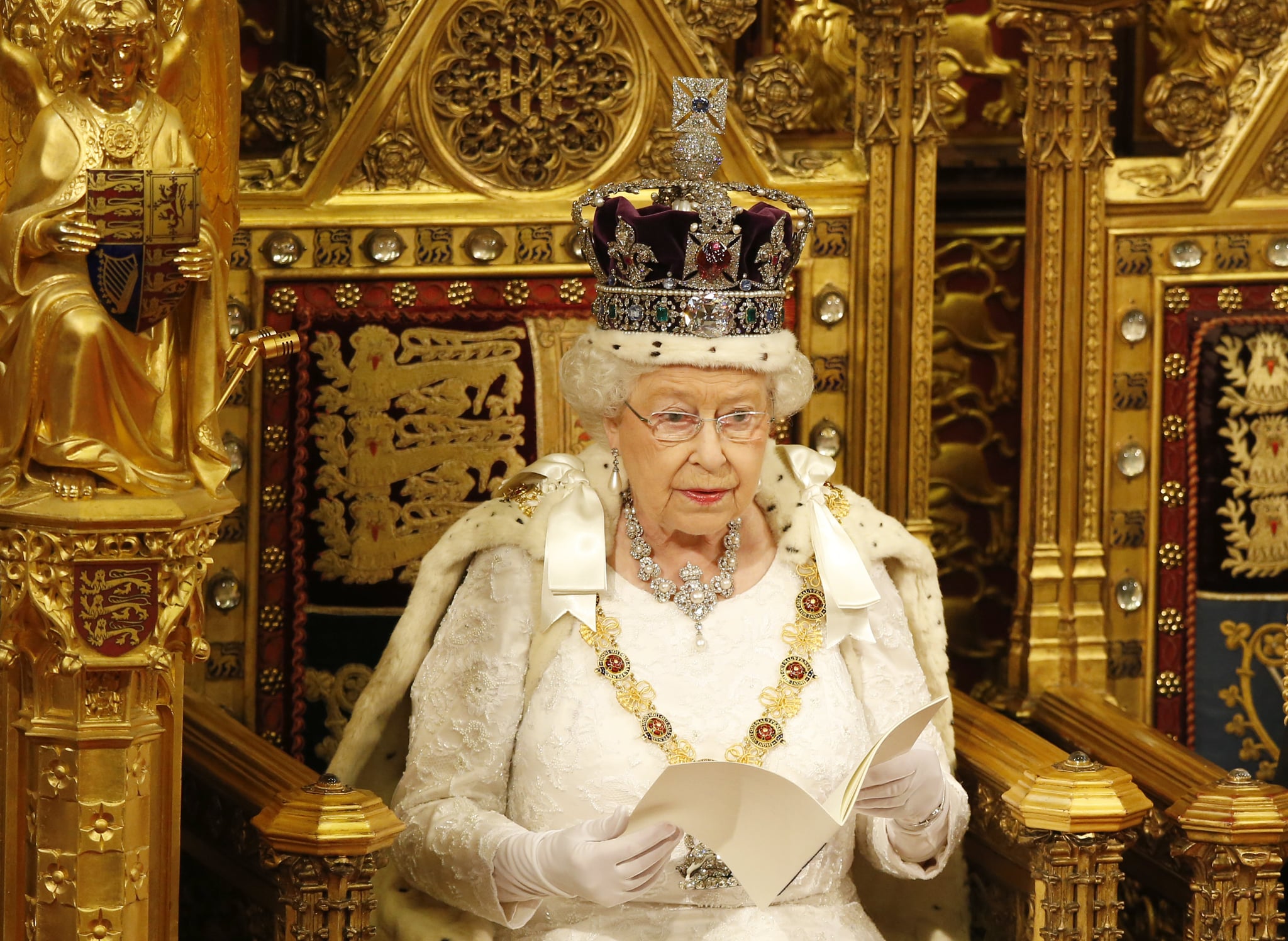 LONDON, ENGLAND - MAY 18:  Queen Elizabeth II reads the Queen's Speech from the throne during State Opening of Parliament in the House of Lords at the Palace of Westminster on May 18, 2016 in London, England. The State Opening of Parliament is the formal start of the parliamentary year. This year's Queen's Speech, setting out the government's agenda for the coming session, is expected to outline policy on prison reform, tuition fee rises and reveal the potential site of a UK spaceport. (Photo by Alastair Grant - WPA Pool/Getty Images)