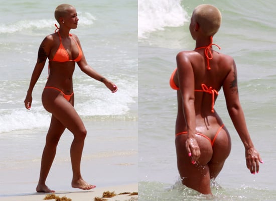 Amber Rose on the Beach in an Orange Thong Bikini