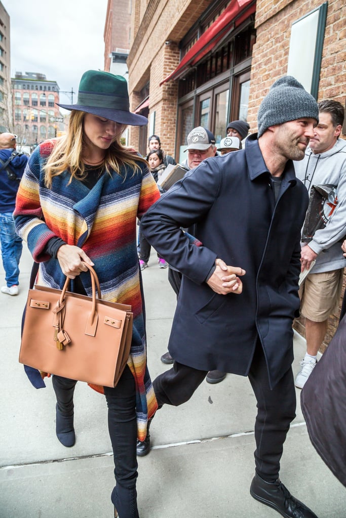Rosie paired a colorblock fedora with a striped coatigan and Saint Laurent bag.