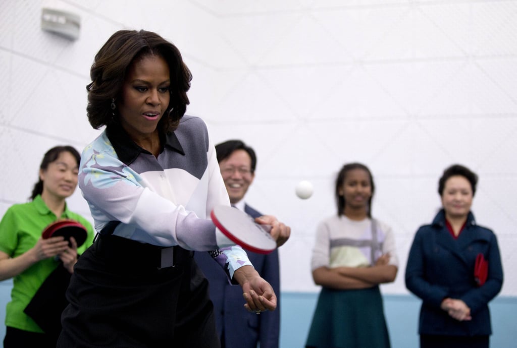 The first lady played some ping-pong while visiting a school that prepares students to study at universities abroad.