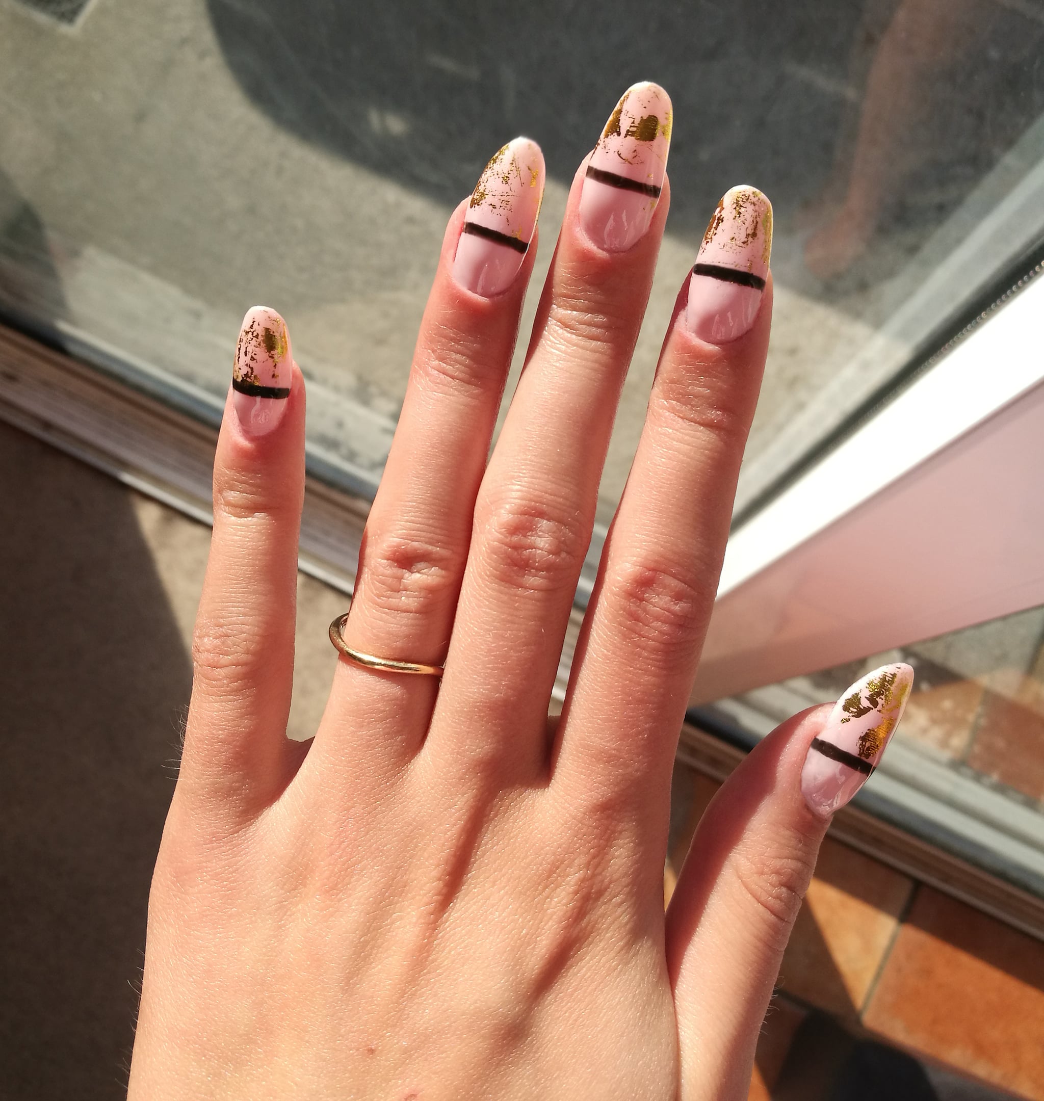 Close up of Fake Nails, Acrylic Nails, Gel nails on a woman's hand in neon colours