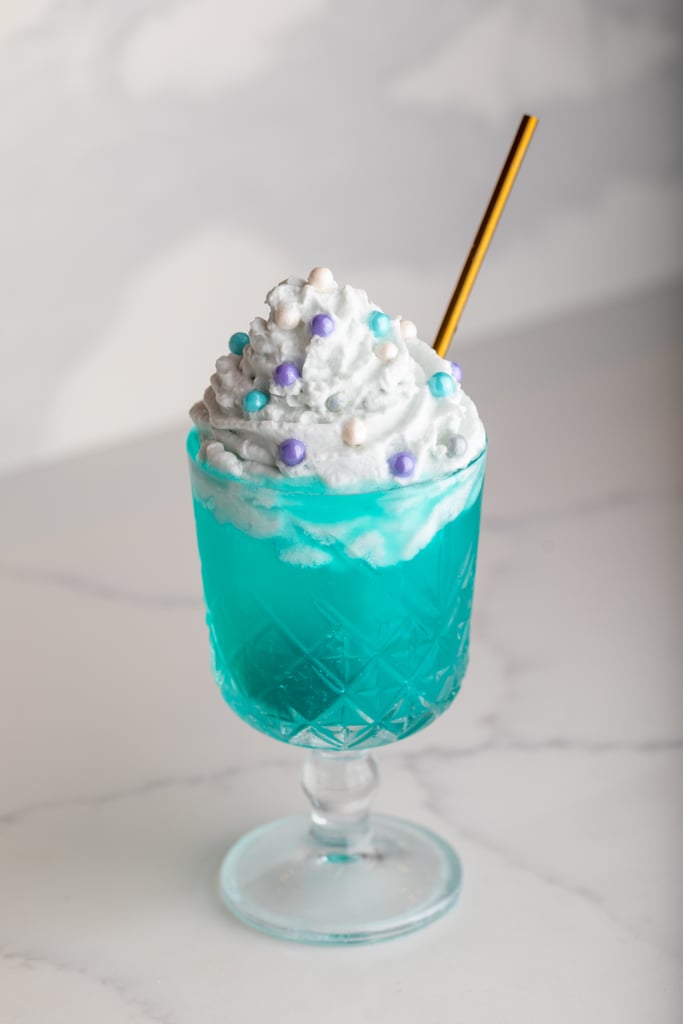 The Dear Daniel cocktail featuring mezcal, tequila, pineapple, lime, spirulina, and salted coconut whip.