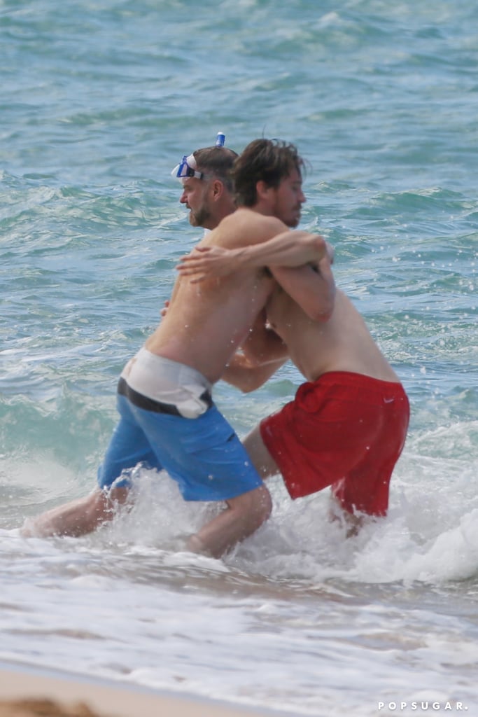 Charlie Hunnam and Garrett Hedlund Wrestle in Hawaii Photos