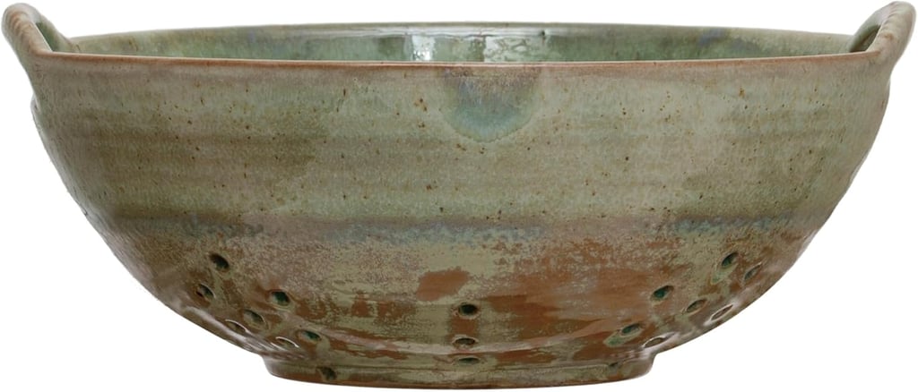 Creative Co-Op Stoneware Berry Bowl with Handles ($24)
Berry season is officially back, and this stoneware bowl is made for it. Designed with drainage holes and easy-to-grip handles, it lets you rinse and serve strawberries, blueberries, or cherries in one step.
