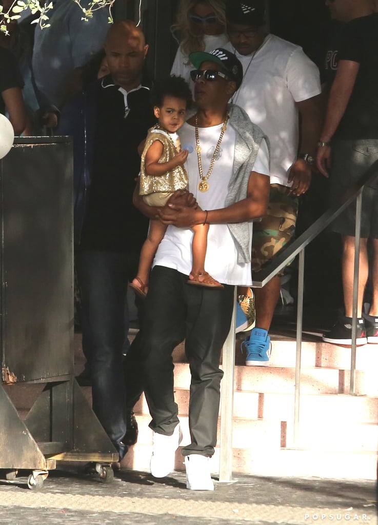 Blue Ivy showed some sass as her dad, Jay Z, carried her.