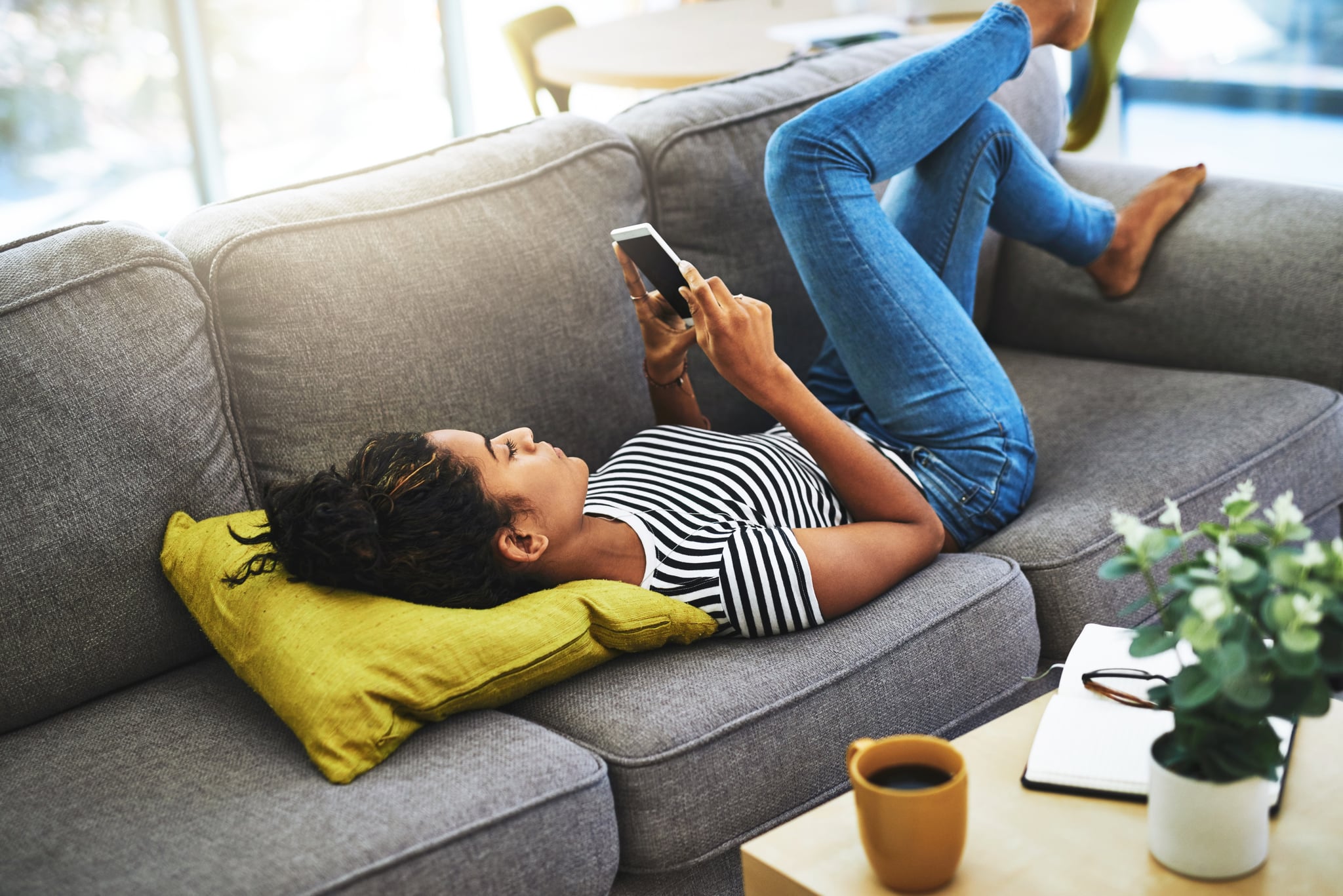 Shot of an attractive young woman relaxing at home on the weekend