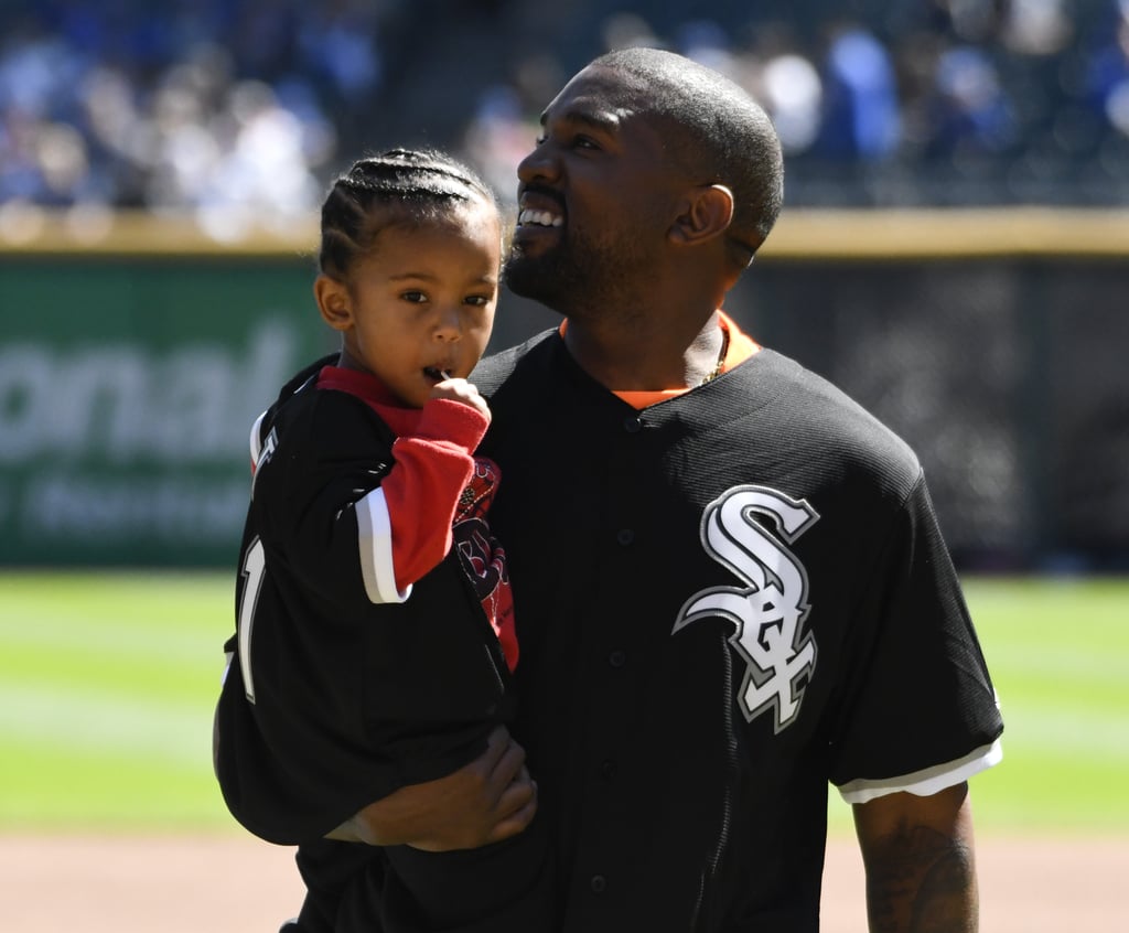Kanye West and Saint West Throw First Pitch at Baseball Game