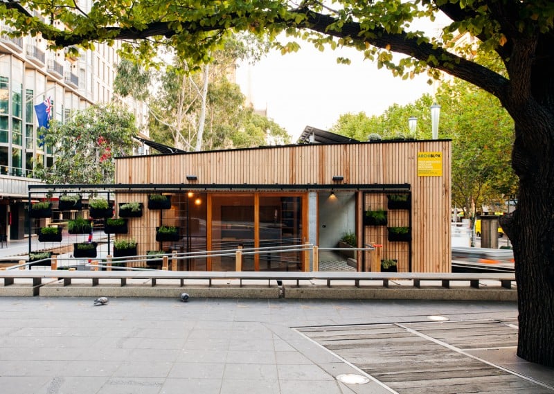 It's topped by a green roof for added insulation, and these sliding garden walls help to shade the building and keep it cool during Summer.
