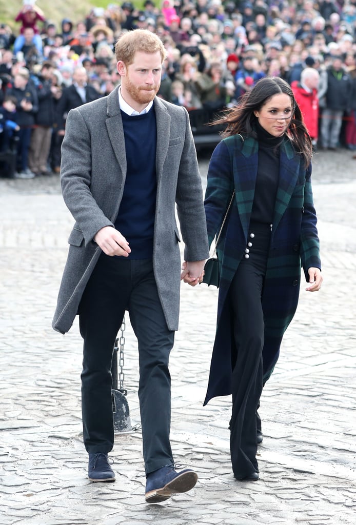 For a visit to Edinburgh, Prince Harry wore a long grey coat, while Meghan chose a tartan Burberry number.