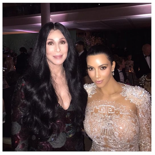 Kim posed for a photo with Cher, explaining that her dress was inspired by the Bob Mackie gown Cher wore to the Met Gala back in 1974.