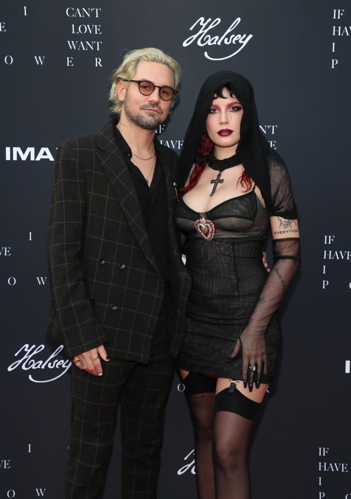 Halsey celebrated the release of If I Can't Have Love, I Want Power surrounded by loved ones. On Tuesday, the 26-year-old attended the premiere of their new IMAX movie in LA alongside boyfriend Alev Aydin. Not only did it mark Halsey's first official appearance since giving birth to her first child in July, but it also marked her red carpet debut with Alev. The couple seemingly coordinated their looks as Alev wore a black suit and tinted sunglasses, while Halsey stunned in a black dress and dark red makeup. 
In July, Halsey first teased that If I Can't Have Love, I Want Power — which doubles as an IMAX movie and an album — would be "about the joys and horrors of pregnancy and childbirth." "It was very important to me that the cover art conveyed the sentiment of my journey over the past few months," they wrote. "The dichotomy of the Madonna and the Wh*re. The idea that me as a sexual being and my body as a vessel and gift to my child are two concepts that can co-exist peacefully and powerfully. My body has belonged to the world in many different ways the past few years, and this image is my means of reclaiming my autonomy and establishing my pride and strength as a life force for my human being." The film is currently playing in theaters, while the album is set to drop on Aug. 27. See more pictures from Halsey's premiere ahead. 

    Related:

            
            
                                    
                            

            16 Halsey Covers That Prove She Can Sing Just About Anything