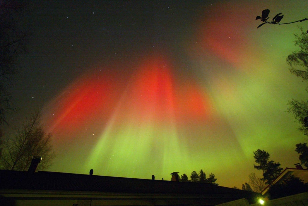 Vivid oranges and greens filled the Finland sky when the northern lights were seen in October 2003.