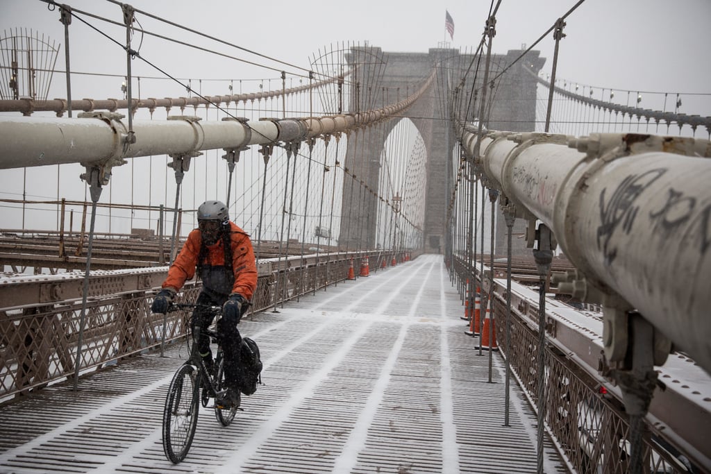 A cyclist wore ski goggles to ride his bike across the Brooklyn Bridge in New York.