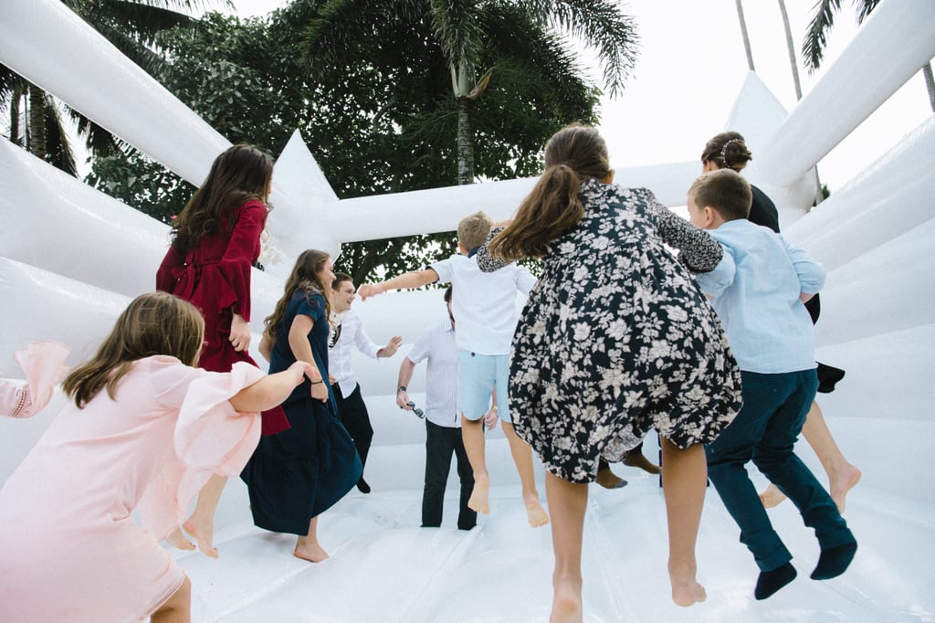 Couple Takes Wedding Photos in Bouncy Castle