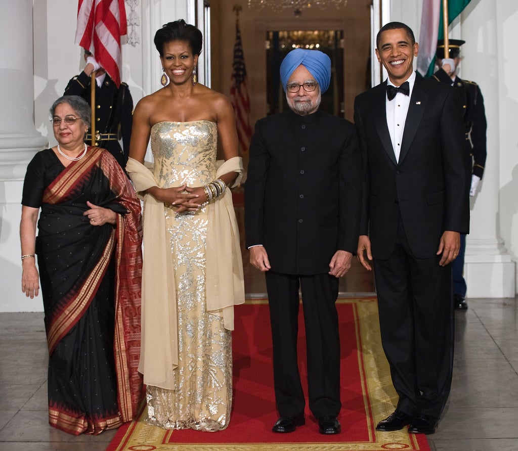 Gursharan, Michelle, Manmohan, and Barack stood proudly in their group photo.