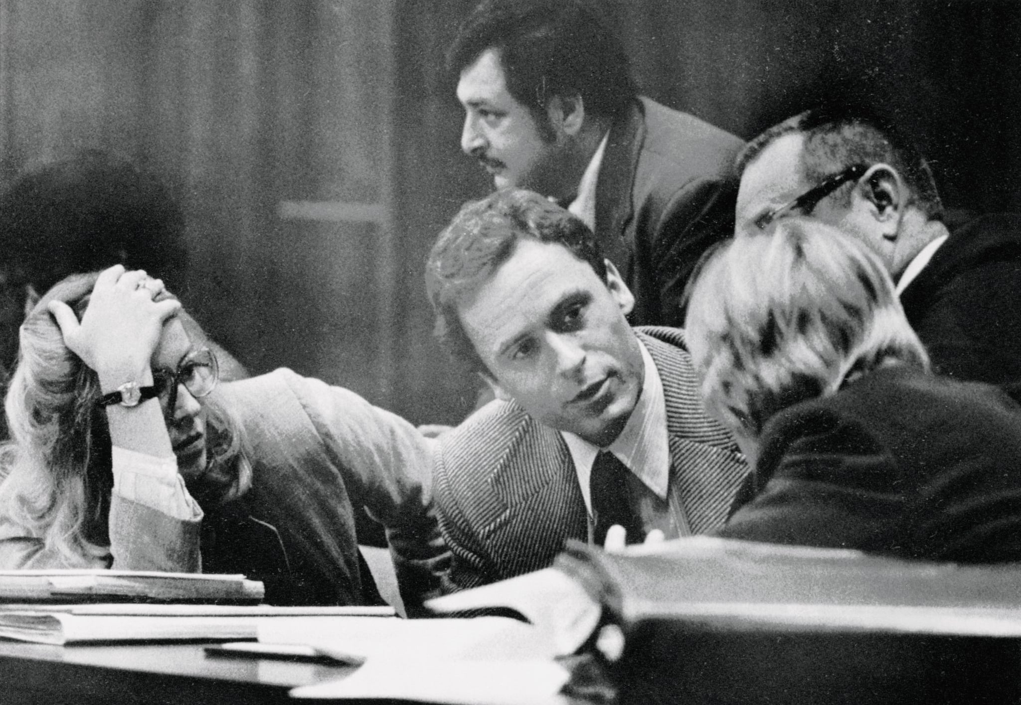 (Original Caption) Accused murderer Theodore Bundy (C) confers with his defence attorneys on the opening day of his trial 6/25. The trial will be televised nationwide as Bundy participates in his own defence, drawing on his experience as a law student. Bundy is accused of killing two FSU coeds.