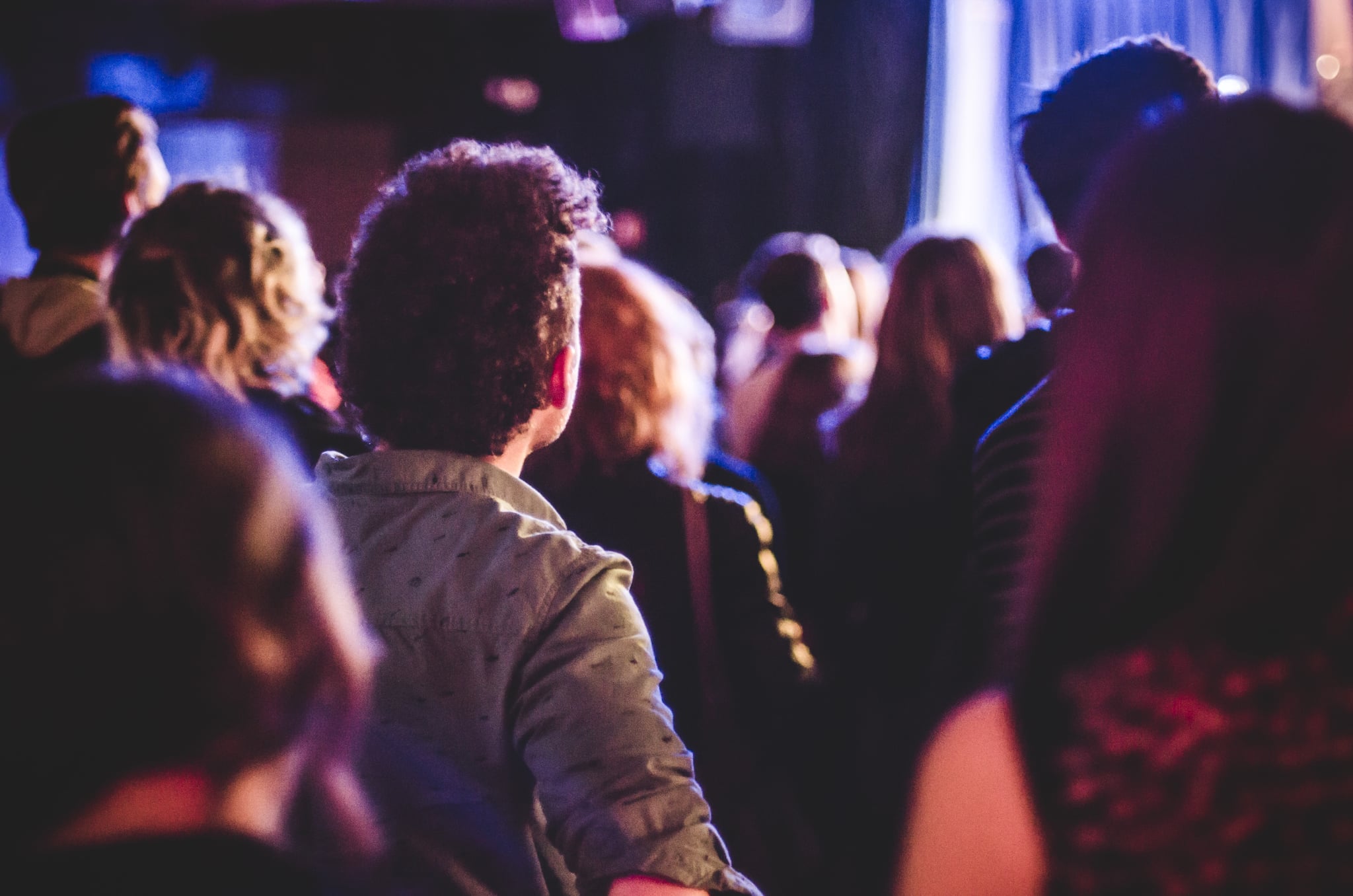 Crowd of People Watching Concert in Small Club Venue. (Photo by: GHI/Education Images/Universal Images Group via Getty Images)