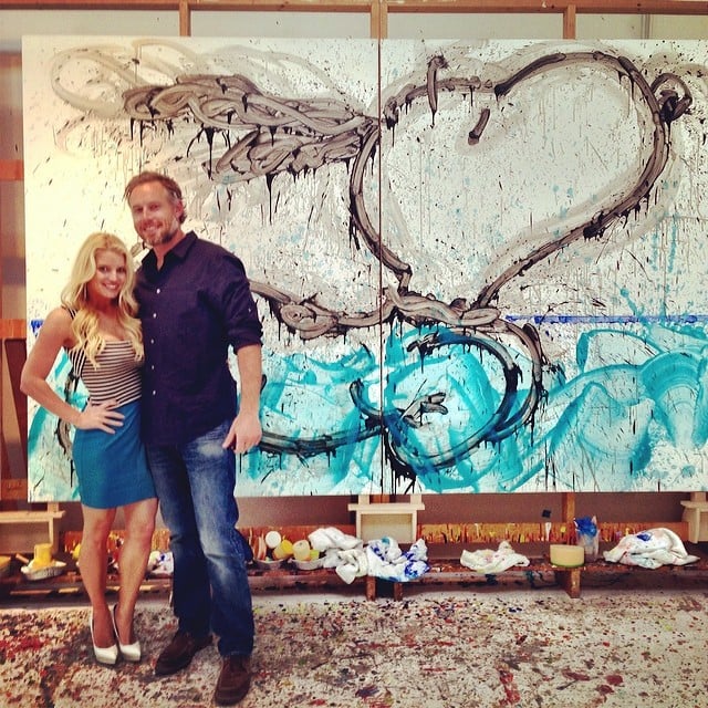 Eric and Jessica posed together in front of their new art piece on their four-year anniversary in May 2014.