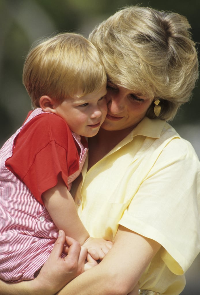 Prince Harry snuggled up to his mum during a holiday in Majorca, Spain, in August 1987.