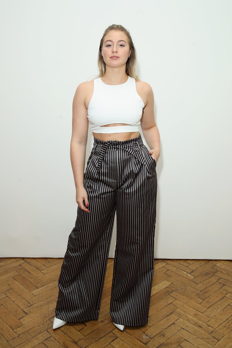 Wearing a White Crop Top by Dama and Amur Striped Pants