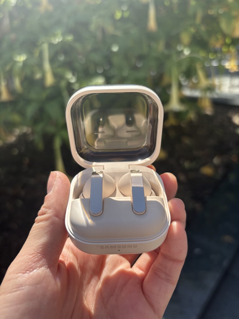 Samsung Galaxy Buds4 Pro ($250)
"I've long had issues with various headphones I've tried. I'm someone who loves to listen to rich-sounding music on my walks and runs throughout San Francisco, but I always deal with my headphones slipping out of my ears as I get sweaty. Or, I'll resort to using just one side because I want to be aware of my surroundings running through intersections on steep hills, where it can be difficult for cars to see pedestrians. 
I've been using the Buds4 Pro on my longer runs and so appreciate them staying put and also allowing me to choose the Ambient setting, which allows me to hear what's going on around me while listening to my favorite running playlist. One morning, I ran from my apartment in the middle of the city down to the beach; while I was running through busy intersections, I kept my Ambient setting on, so I could hear cars approaching. Once I got to a safe path by the Bay, I put on my Active Noise Canceling setting because the wind was whipping past me. All I could hear was the smooth sound of Olivia Dean singing into my ears, encouraging me to keep going. 
The buds themselves are comfy, and I haven't dealt with them slipping out of my ears. I've also found I use the Active Noise Canceling setting (which you can adjust on a scale) most at home to drown out my cat, who meows incredibly loudly when it's feeding time. Like Privacy Display, the buds give you total control of how you want to experience your tech in your surroundings, and I have to say, that authority feels good." — Lena Felton, senior special projects director