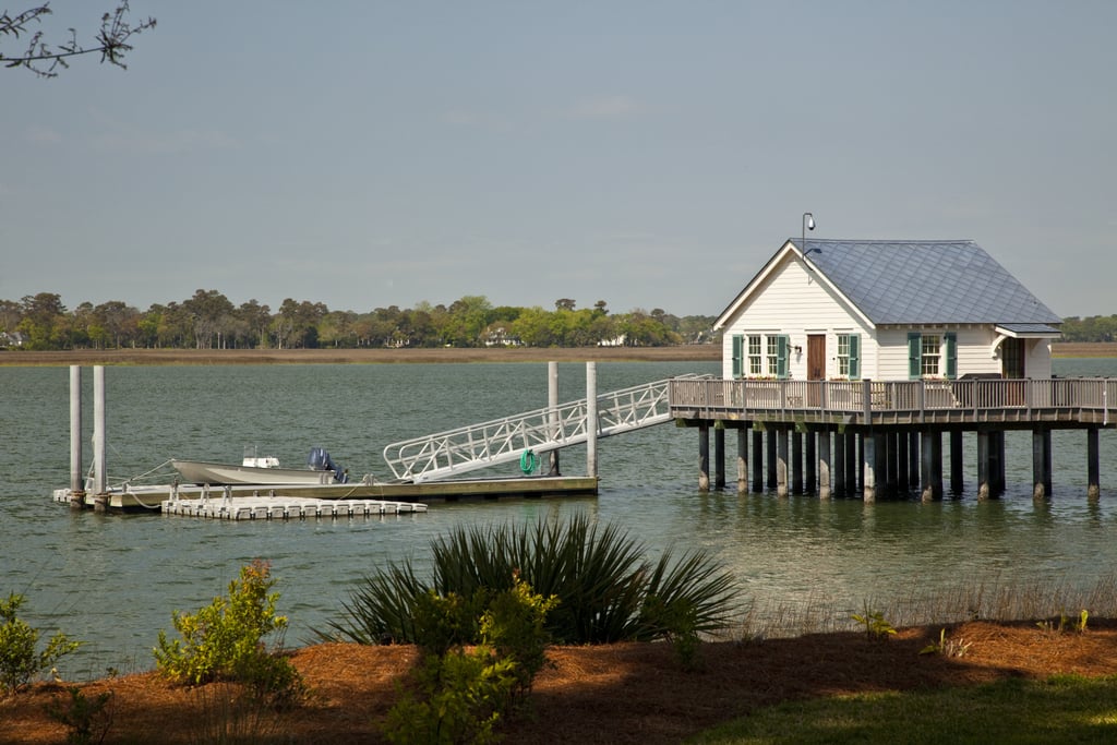 A charming dock house is perched atop the Wilmington River along the